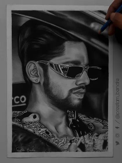 A step-by-step look at my 85-hour portrait of Baseer Ali. You can see the grid lines and how I build up the layers of graphite and charcoal to create a photorealistic effect.