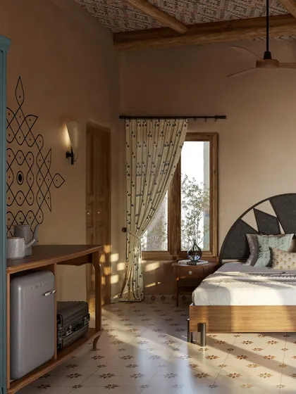 Sunlight streams into the room, casting beautiful shadows and highlighting the hand-painted *kolam* and the texture of the mud walls. This space is designed to feel bright, airy, and deeply calming.