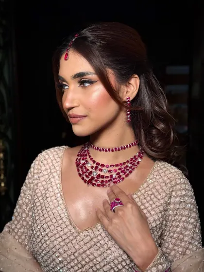 A side profile showing the beautiful highlight and dewy finish of this signature look.
