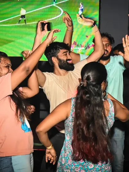 The crowd at Sherlock's Lounge in Coimbatore, celebrating and dancing in front of a live sports screening. I can adapt my set to any venue's setup.