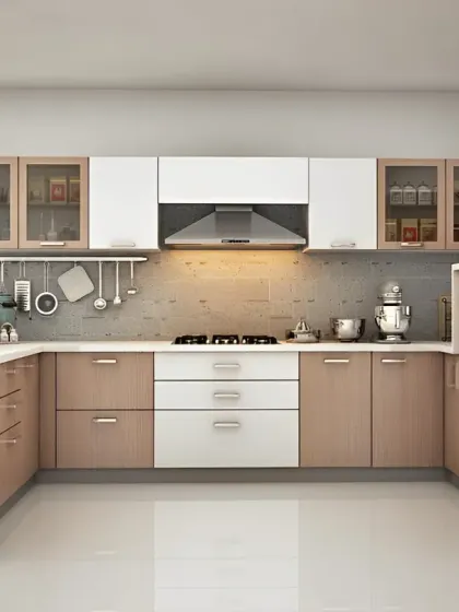 A spacious U-shaped kitchen with a calming, neutral color palette. The two-tone design with light wood and white cabinets keeps the space feeling bright and open, with ample storage and countertop area.
