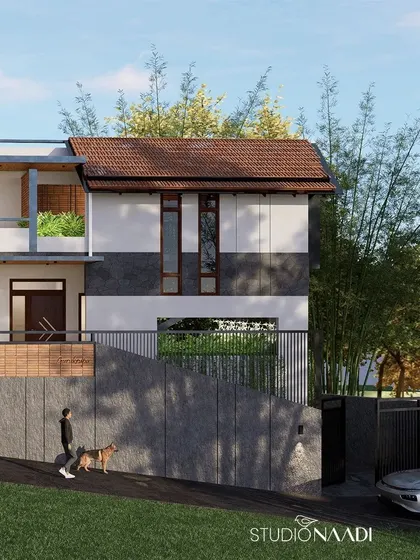A closer look at the facade, where the clean lines of the structure are contrasted with the texture of the stone-clad boundary wall and the softness of the bamboo grove. The design respects the natural contours of the land.