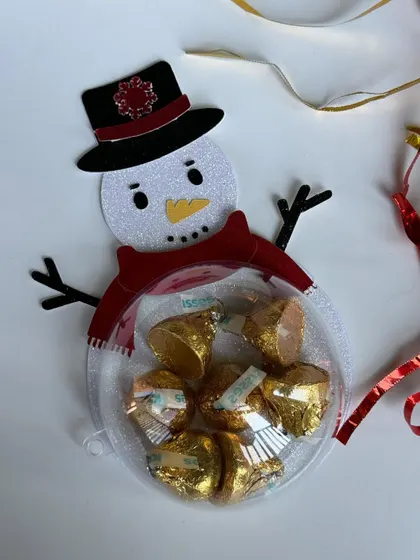 Our handmade snowman chocolate bauble, a fun and festive treat holder for the holidays.