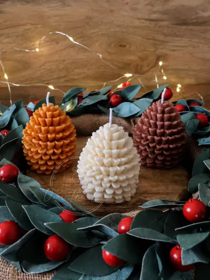 Another look at the cozy pinecone candles, perfect for bringing a touch of the outdoors in during the winter months.