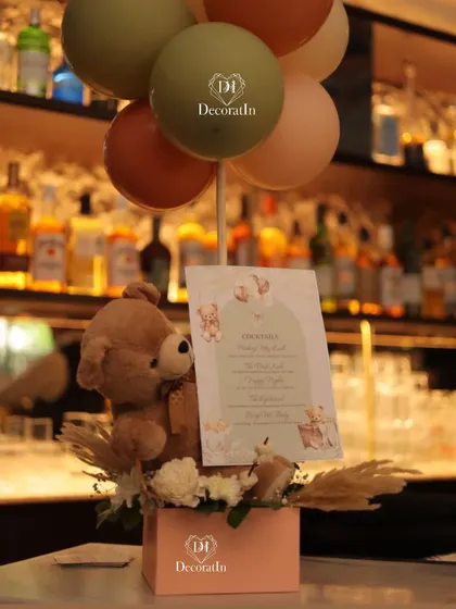 A custom bar menu for the baby shower, with themed cocktail names like "Blushing Mamma" and "Baby Maker."