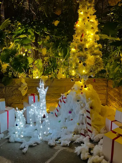 Another angle of the winter wonderland scene, showing the candy cane props and wrapped presents.