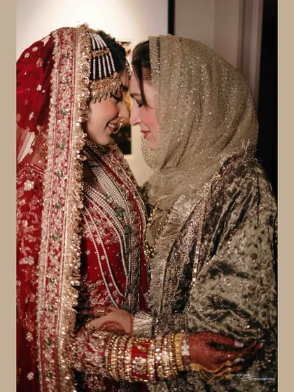 A heartfelt moment between the bride and her mother. The shared smile and gentle touch convey a lifetime of love and blessings for the new journey ahead.