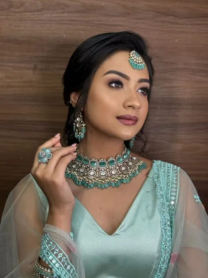 Another angle of the elegant party look, showcasing the beautiful mint-green jewelry and coordinated makeup.