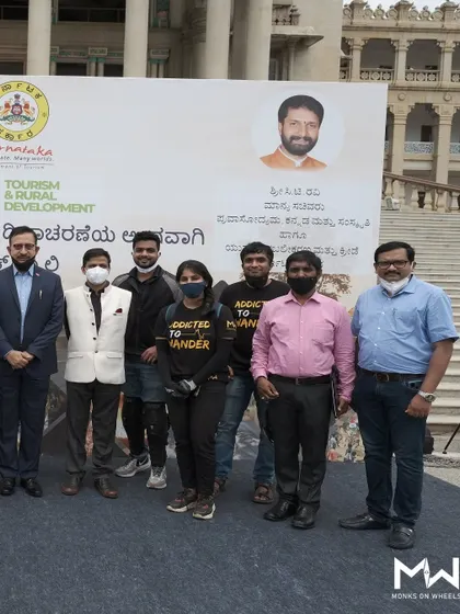My crew posing with officials in front of the Vidhana Soudha for the World Tourism Day ride. These collaborations highlight my credibility and expertise.