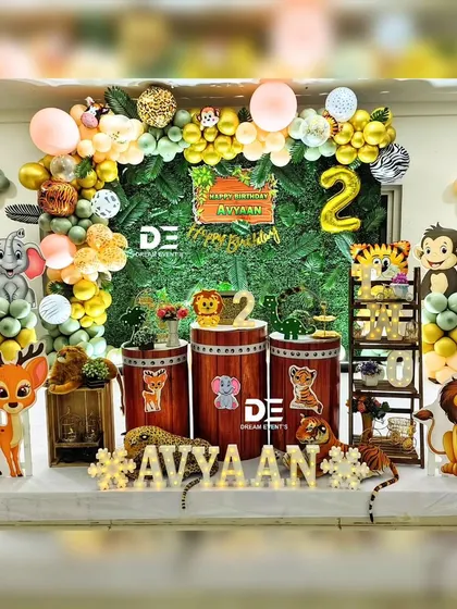 A complete stage setup for Avyaan's second birthday. The jungle theme includes a variety of animal cutouts, light-up letters for the name, and a backdrop that makes you feel like you're in the heart of the jungle.