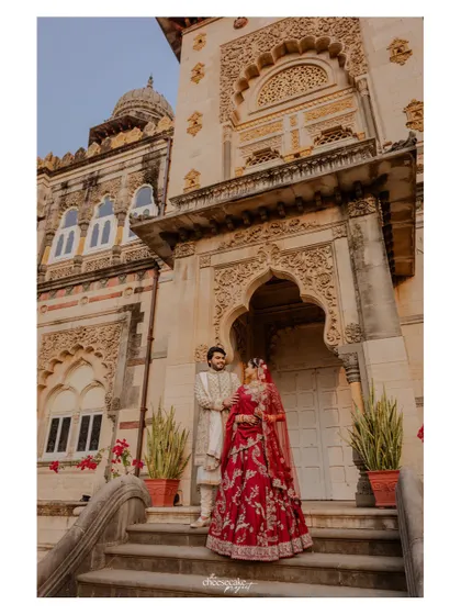 A classic couple portrait on the steps of the palace.