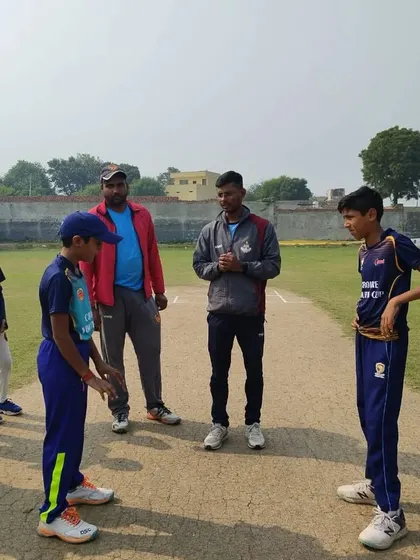 Coaches and umpires overseeing the toss. We ensure all matches are conducted with professionalism.