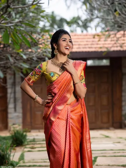 Ragini looking happy and confident in the beautiful orange saree. It was the perfect start to our 'Navataara' series.