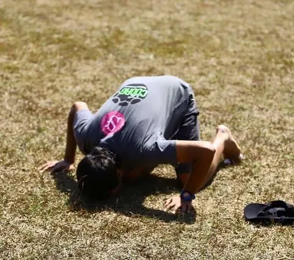 Bowing to the ground in a gesture of thanks. The Barefoot Marathon is a spiritual journey as much as a physical one.