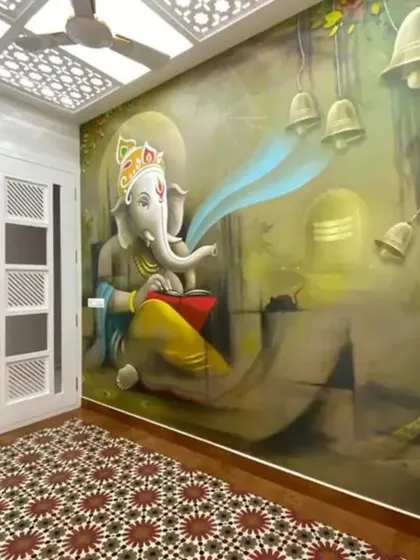 A vibrant and powerful mural of Lord Ganesha in a pooja room, creating a divine focal point for prayer and meditation.