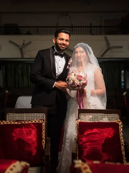 A classic portrait of the bride and groom inside the church, ready to start their new life together.
