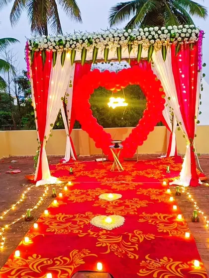 I can set up the perfect romantic moment for proposals and anniversaries. This outdoor arrangement features a heart-shaped balloon arch, a 'Better Together' neon sign, and a candle-lit walkway for an unforgettable experience.