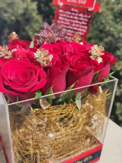 May your love bloom forever. For Rose Day, we created this stunning arrangement of fresh red roses in a modern acrylic box, with a single Swarovski crystal rose to make it extra special.