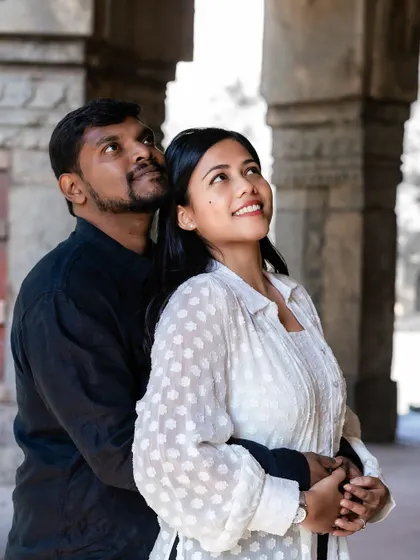 The couple looking up together, sharing a moment of hope and anticipation for their future.