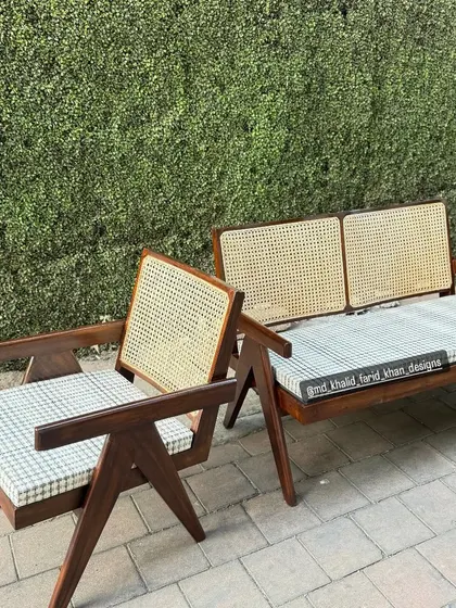 Detail of the armchair and bench, showing the comfortable cushions and the sturdy teak frame.