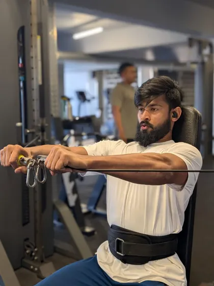 Focused on a seated cable fly, an isolation exercise that helps define the chest muscles and improve the mind-muscle connection.