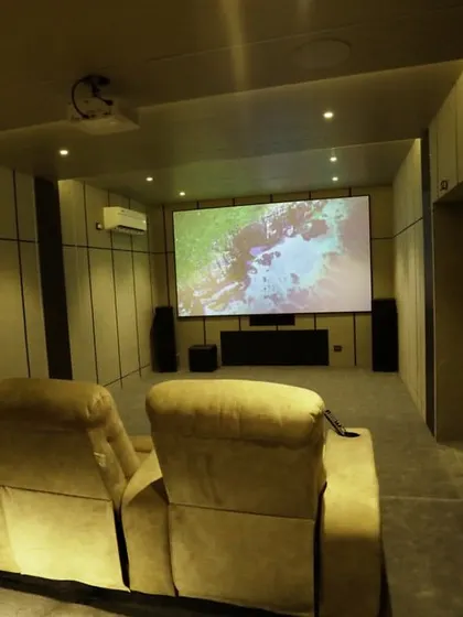 A duplicate of 371, this shot showcases the clean front of the room, with the large screen and powerful speakers.