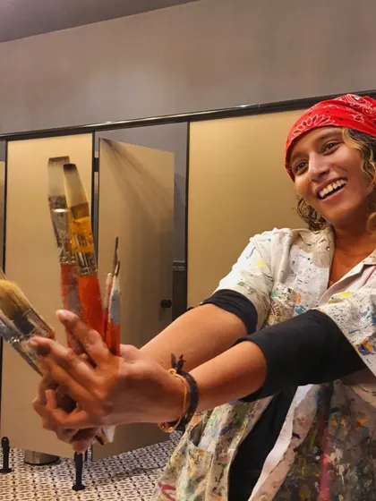 The only spell here is the secret color behind these smiles. Me, happy and covered in paint, holding up my trusty brushes. This is me in my natural habitat.
