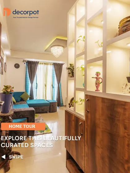 Explore this beautifully curated space, starting with a living room divider that is both a storage unit and a vertical garden. The backlighting adds a warm glow to the entire area.