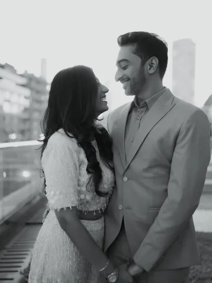 A classic black and white portrait from an urban shoot. The soft light and genuine smiles create a timeless and romantic image that focuses entirely on the couple's connection.