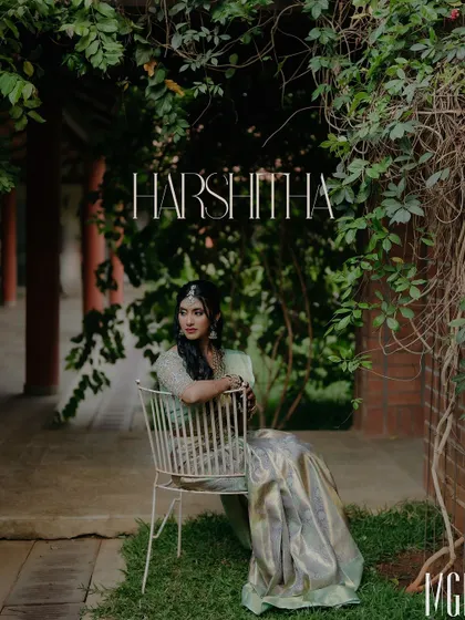 A serene portrait of the bride-to-be, seated in a garden setting. The natural light and lush green background create a peaceful and elegant mood for this engagement photo.