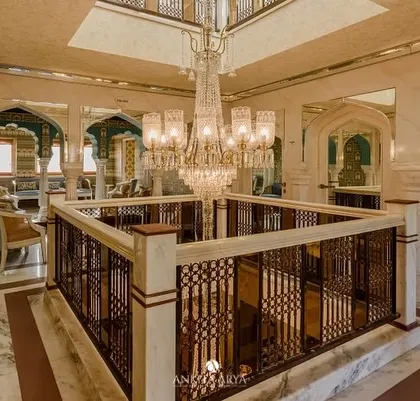 The grand atrium of the Surya Haveli in Jaipur. While my wallpaper is in the adjoining rooms, this view captures the overall sense of opulence and heritage that my designs were created to complement.