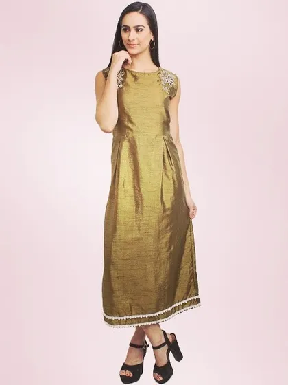 A model wearing a sophisticated olive green dress made from shimmering fabric. This sleeveless midi dress features subtle embroidery on the shoulders and a delicate lace hem.