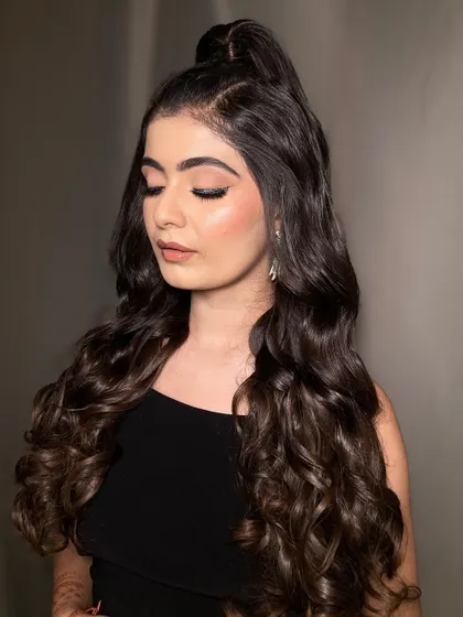 A close-up of the soft glam eye makeup paired with the wavy ponytail. The look is defined but not heavy, perfect for someone who wants to look effortlessly chic.