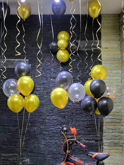 A simple arrangement of helium balloon bunches for a birthday surprise.