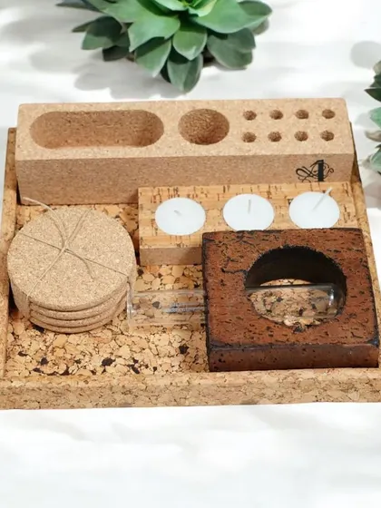 This compact cork desk organizer set is perfect for keeping essentials tidy. It includes coasters, tea light holders, and storage compartments in a convenient tray.