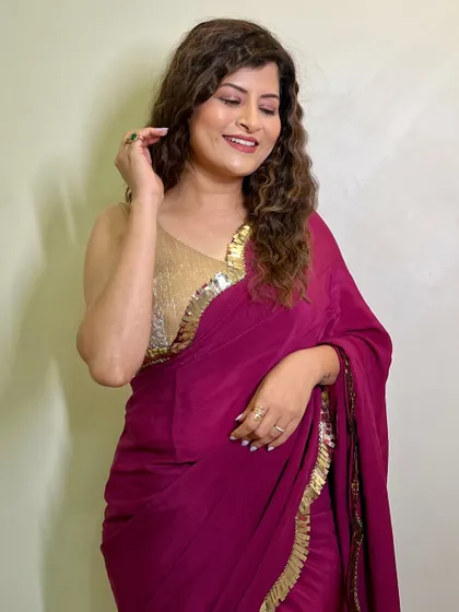 A joyful, candid moment. This image captures her beautiful smile and the easy, glamorous vibe of the whole look.
