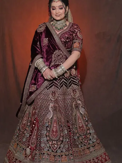Another angle of our peacock-embroidered velvet lehenga, showing how the design flows across the entire outfit for a cohesive, royal look.