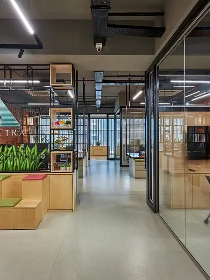 An unconventional reception area that doubles as a collaboration space, featuring tiered, amphitheater-style seating. This design encourages interaction from the moment someone steps into the office.