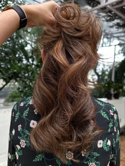 A fun, messy updo showing off the versatility of the 'Caramello' color and cut.