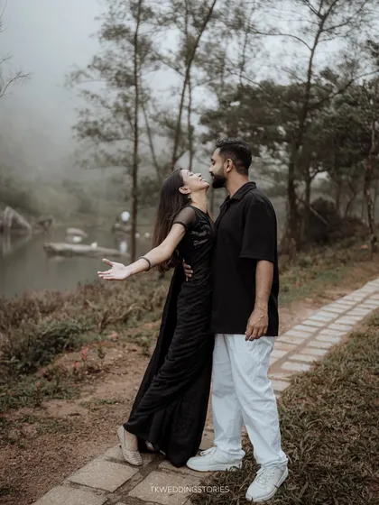 Capturing a candid moment of joy and affection during a pre-wedding shoot. The natural setting and the couple's relaxed interaction result in authentic, heartfelt images.