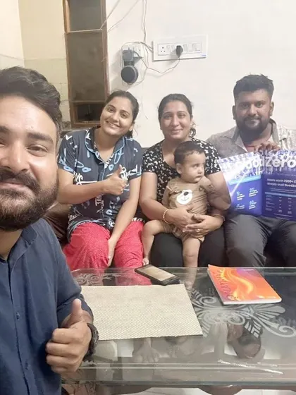 A family with a baby celebrates their decision to go solar. We are proud to provide a cleaner future for their children.