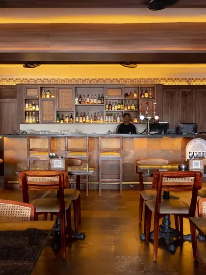 This bar area is designed for comfort and conversation. The warm wood tones, classic rattan chairs, and soft backlighting create a relaxed and timeless atmosphere where guests can feel at ease.