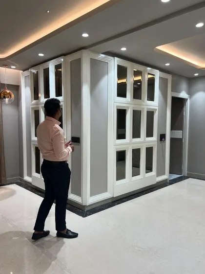 Another view of the large mirrored wall, showing how it reflects the room and enhances the sense of space.