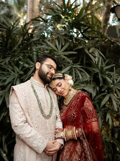 A tender moment where the bride rests her head on the groom's shoulder. These are the simple, heartfelt gestures that define a love story.