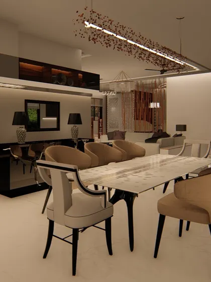This formal dining area features a marble-topped table and elegant, high-backed chairs. A modern, artistic chandelier hangs above, and a sleek black console table sits against the wall for serving and display.