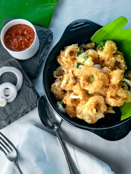 Golden and crispy, my garlic butter-infused fried squid steals the show at our seafood fest.
