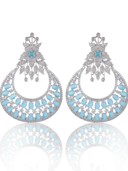 A clean, professional e-commerce photo of diamond and stone earrings. The focus here is on sharp detail, accurate color, and a subtle reflection to create a high-end look for online catalogs.