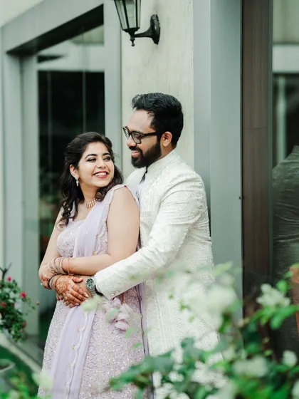 A sweet and happy portrait of a newly engaged couple, their smiles reflecting the joy of the moment.