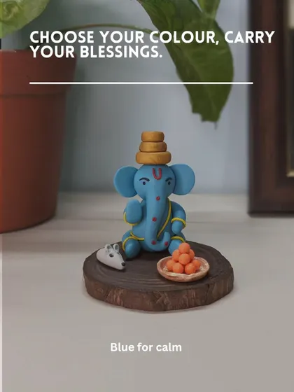 A beautiful blue Ganesha for calm. This serene idol sits peacefully with his offerings, designed to create a tranquil atmosphere wherever you place it.