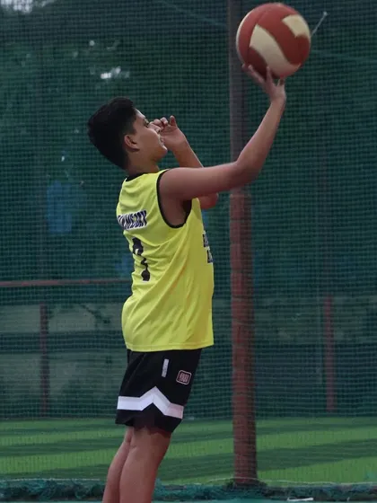 A young player practices his layup form. We focus on perfecting the fundamentals to build a solid foundation for every athlete.
